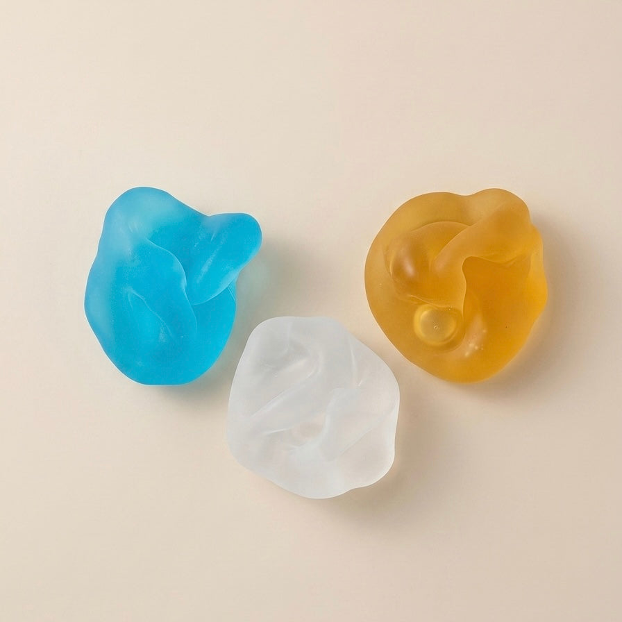 SQUU slime-based matte mochi squishy stress toys with a soft moldable texture for sensory play and ASMR.