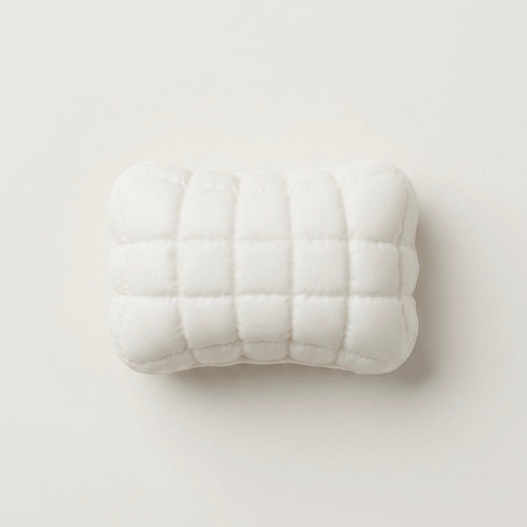 Ultra-soft sticky Mellow Pillow TABA squishy sensory toy with a white quilted cushion design for bare-hand or bag play.