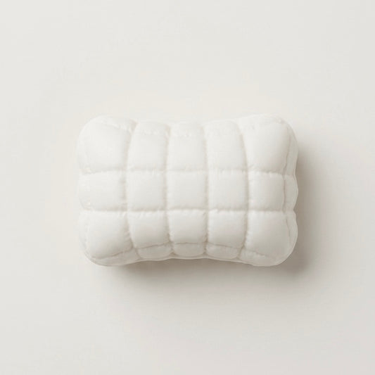 Ultra-soft sticky Mellow Pillow TABA squishy sensory toy with a white quilted cushion design for bare-hand or bag play.