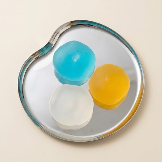 Blue, clear and yellow SQUU squishy  toys for stress relief, fidget play and satisfying ASMR.