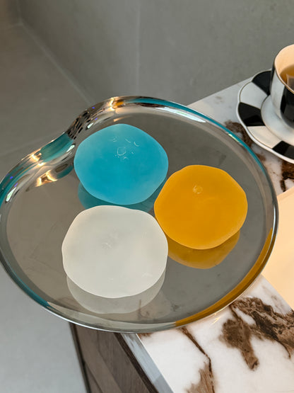 Blue, clear and yellow SQUU slime-based mochi squishies for sensory play, stress relief and satisfying ASMR.