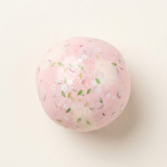 Handmade Sakura Cream Cheese squishy stress ball with pink floral details, thin skin, creamy sensory filling, and decorative cherry blossom accents.