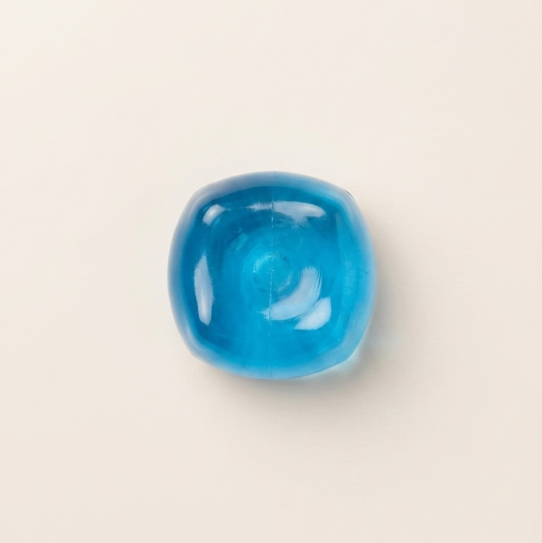 Blue cube squishy stress toy with a translucent glossy finish, rounded shape, and smooth sensory surface.