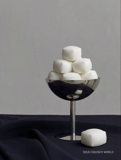 Ultra-fluffy Cloud Tofu squishy stress cubes with soft airy texture and matte white finish displayed as a SQUU collection.