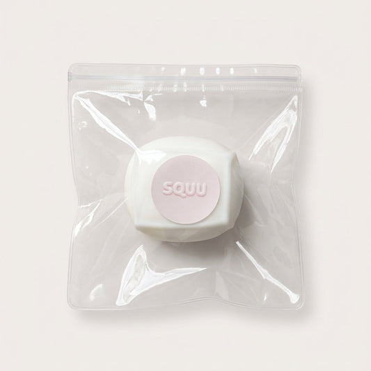 Ultra-fluffy Cloud Tofu squishy stress cube in clear SQUU packaging with soft matte white surface and branded label.