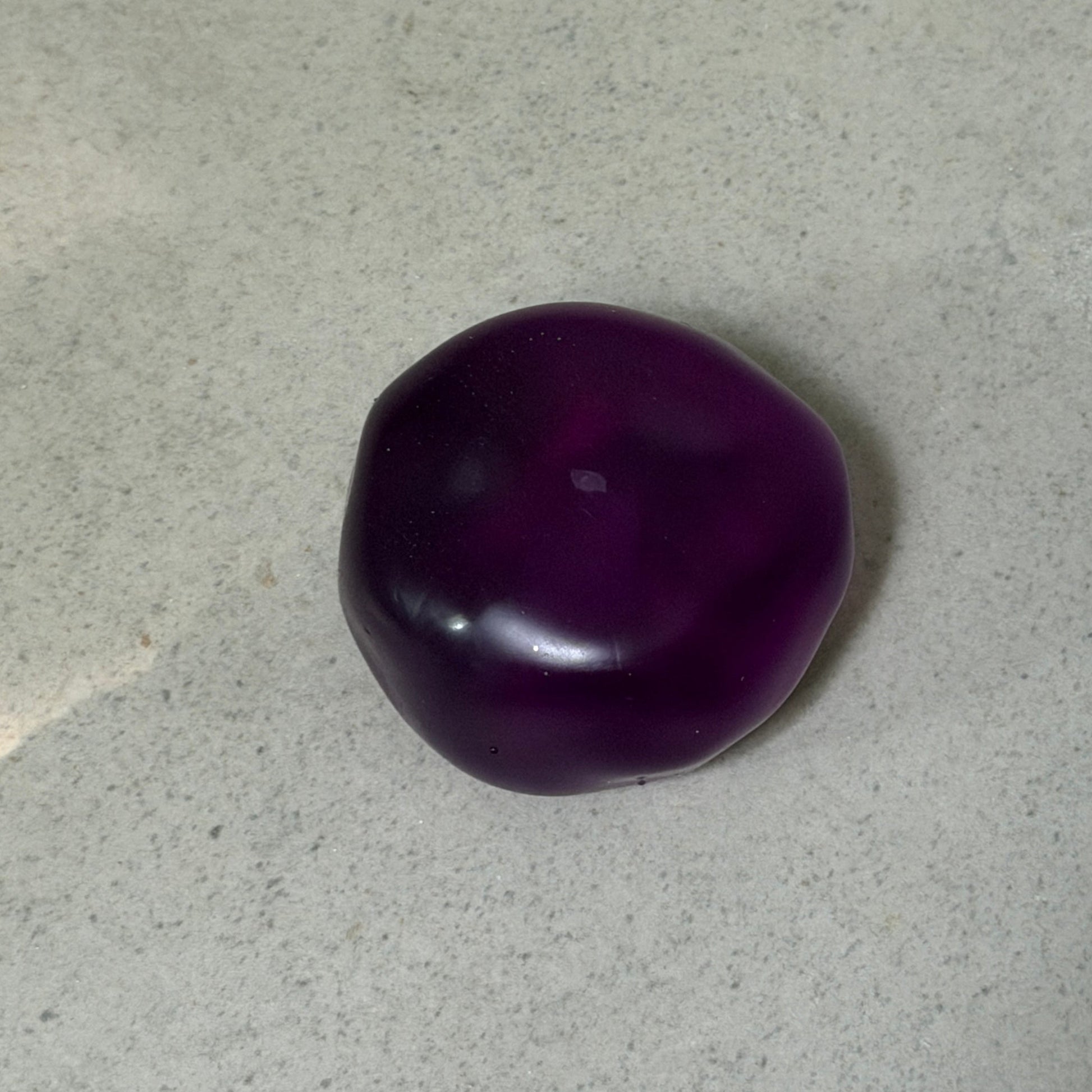 Ultra-soft crystal purple grape squishy stress ball with zero-rebound moldable texture, deep translucent color, and non-sticky surface.