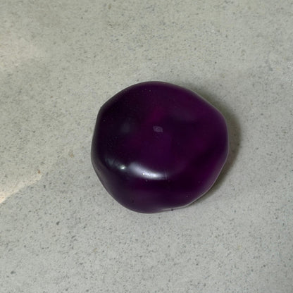 Ultra-soft crystal purple grape squishy stress ball with zero-rebound moldable texture, deep translucent color, and non-sticky surface.