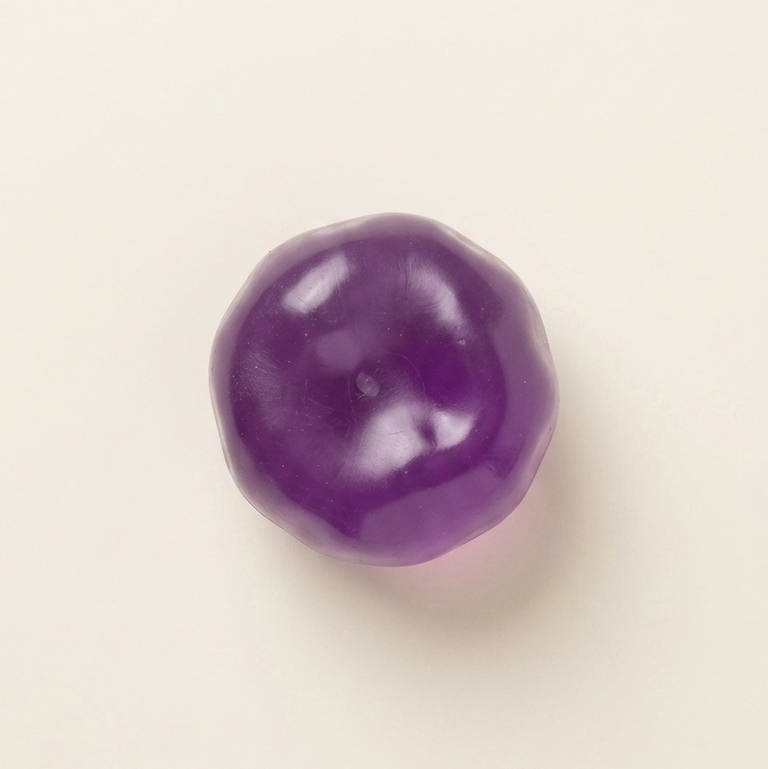 Crystal purple grape squishy stress ball with ultra-soft zero-rebound texture, translucent purple finish, and non-sticky surface.