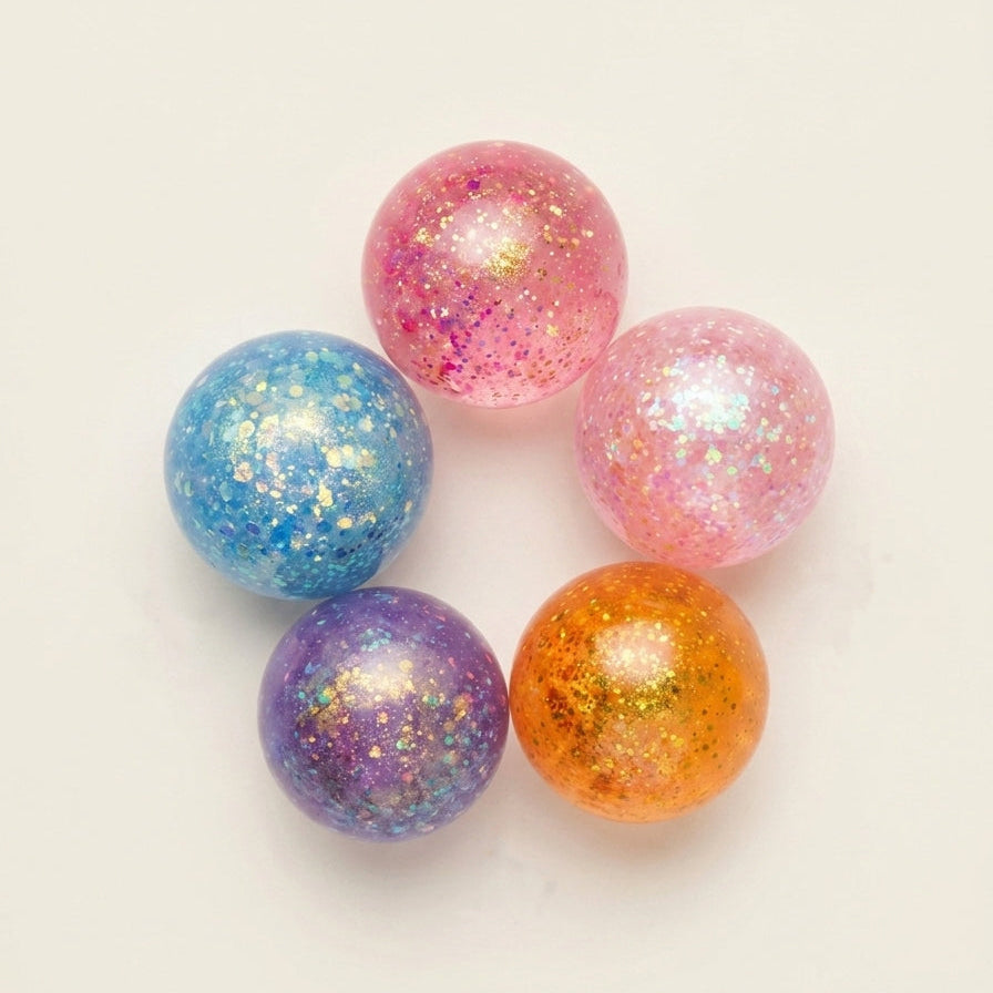 Glitter maltose squishy stress balls with translucent colors, sparkling confetti, moldable texture, and satisfying slow rebound.