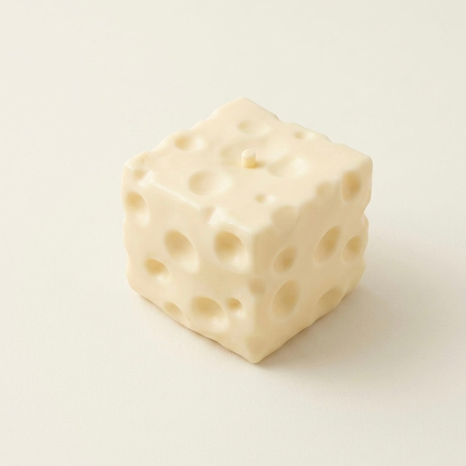 White jumbo cheese squishy stress ball sensory toy with Swiss cheese texture for ASMR and fidget play.
