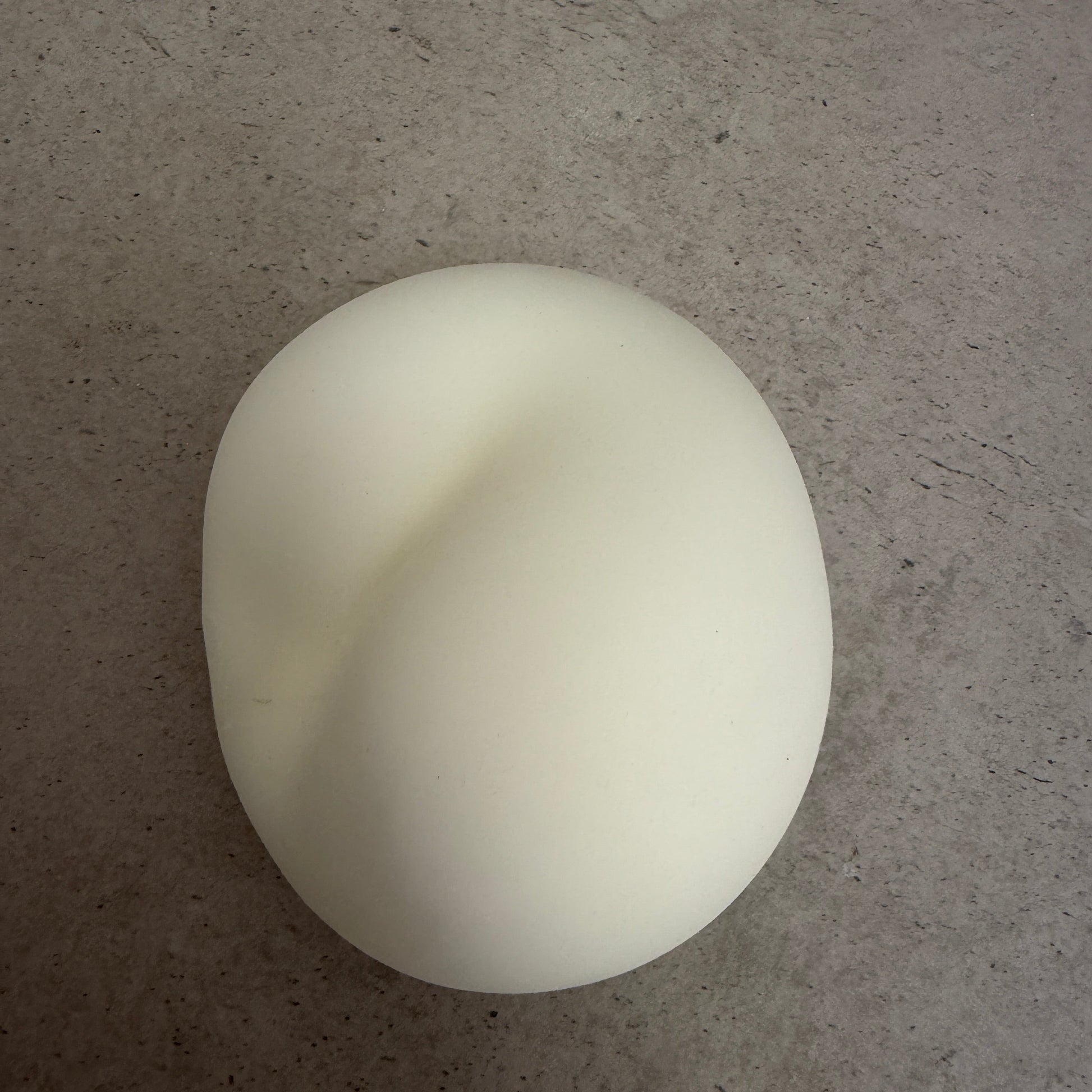 9cm Jumbo Zen squishy stress ball with soft doughy texture showing a deep hand-press indentation and slow-rise rebound.