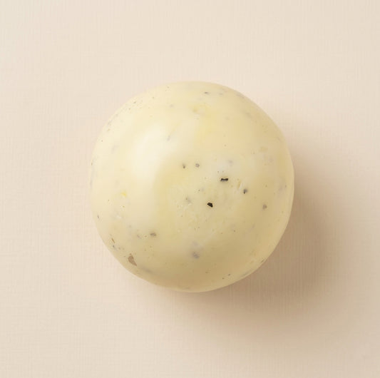 Ultra-soft round mashed potato squishy stress ball with grainy texture, thin skin, moldable filling, and black pepper details.